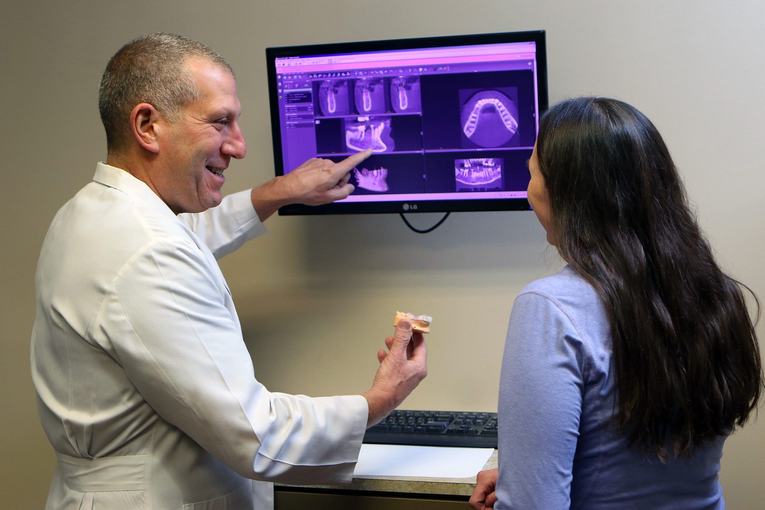 Dentist Dr. Seth Kimmelman showing patient Dental X-Rays in Colorado Springs CO